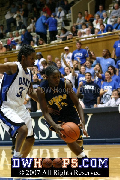 TaShama Banner drives on Keturah Jackson in the final moments