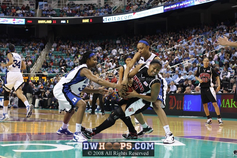 Carrem and Keturah try to get the ball from Ashleigh Newman