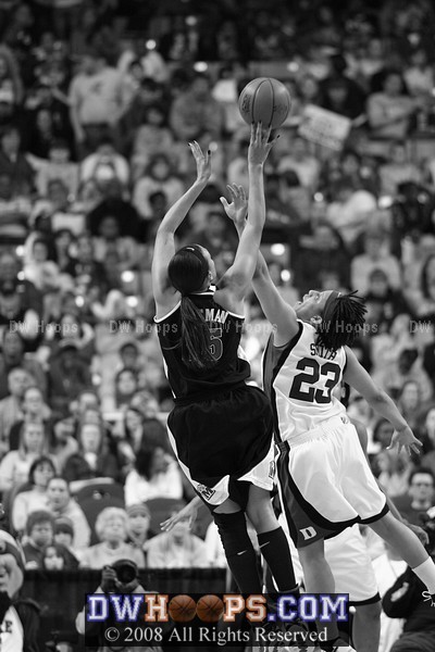Marissa Coleman shoots over Wanisha Smith