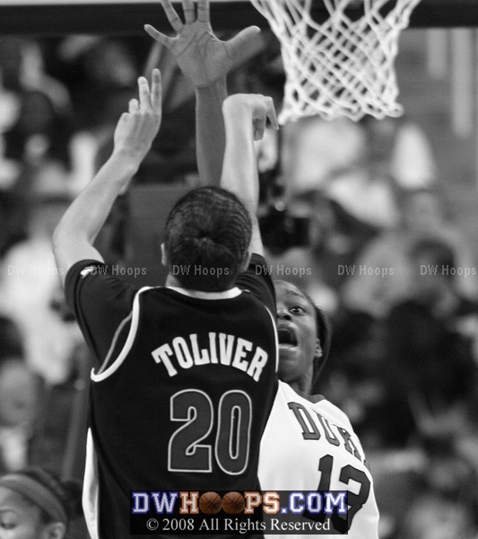 Kristi Tolliver shoots over Karima Christmas (B&W)