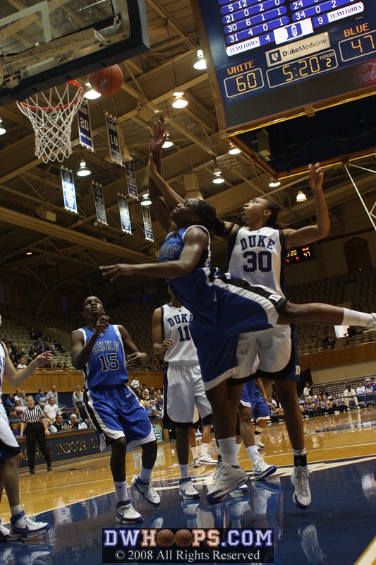 Karima Christmas drives past Carrem Gay to the basket