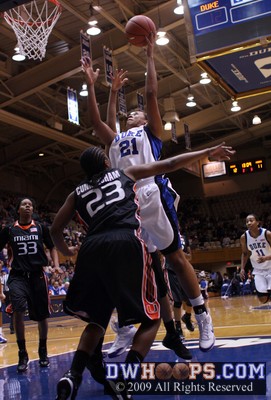 Joy Cheek splits a pair of Miami defenders and scores