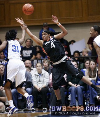 Keturah Jackson competes with Lamese James (4) for a rebound