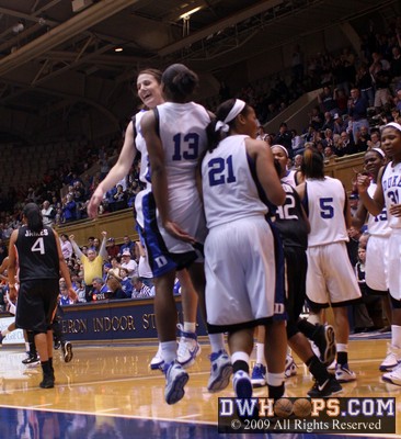 Abby Waner and Karima Christmas share a chest bump after Karima's basket forced a Canes timeout