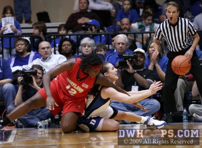 Abby Waner gets a loose ball away from Lynetta Kizer as referee Dee Kanter looks on.  Kizer was injured on the play but returned a couple minutes later. -  - O12.D4;1, 13:29, 8-9