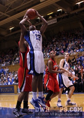 Karima Christmas muscles the ball through a potential shot-block to convert -  - D13;2, 13:15, 45-38