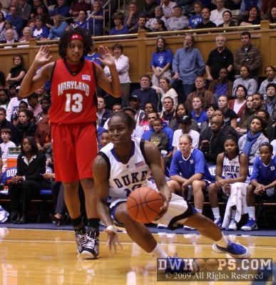 Karima Christmas draws a foul from Demauria "Who, me?" Liles.