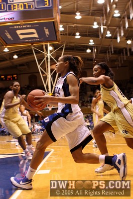 Jasmine Thomas blows by Shaday Woolcock en route to a layup, and the rout was on in Cameron