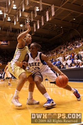Karima Christmas tries to drive past Iasia Hemingway