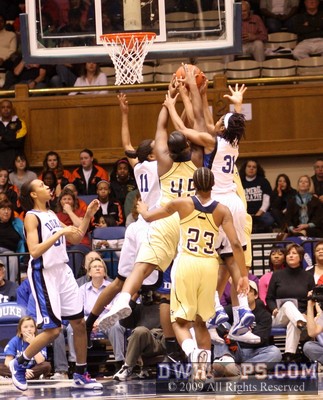 Bodies packed into the lane, all trying to rebound a miss by Mo Bennett.  The ball ended up going out to Duke.