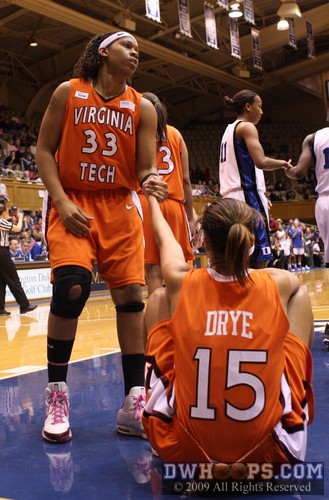 Shanel Harrison helps Drye off the floor