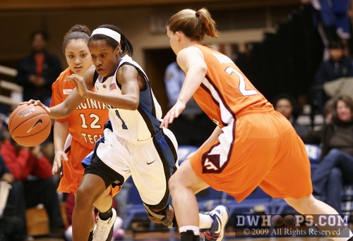 Chelsea Hopkins dribbles through pressure from the Virginia Tech backcourt