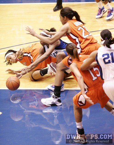 Players scramble for a loose ball