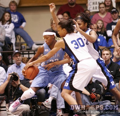 Carrem Gay and Keturah Jackson gang up on UNC's Rashanda McCants, forcing a travel