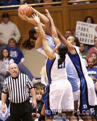 UNC freshman Chay Shegog fights through the double team of Joy Cheek and Chante Black to score in the paint