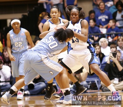 Karima Christmas ties up Italee Lucas - ball stays with UNC
