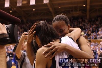 Abby Waner, Carrem Gay, and Chante Black embrace at center court after the most dramatic Senior Night victory in Duke history (second of two photos)