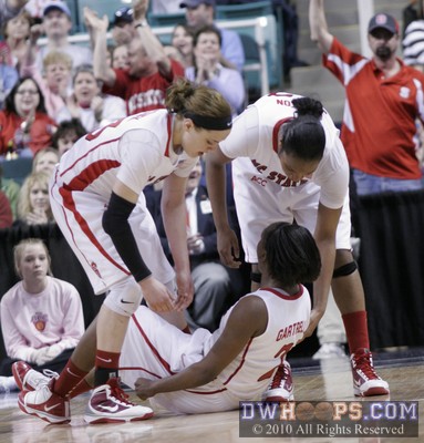 Kastanek and Holston help Gartrell up. -  - 