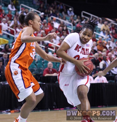 Amber White tries to split the defense of Morganne Campbell (left) and April Parker -  - 