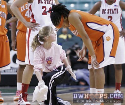 Action pauses for a sweat girl to help wipe the floor -  - 