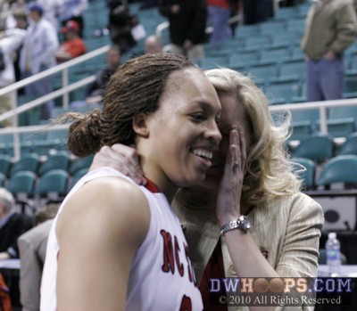 Walking off the court in victory, Kellie Harper whispers a happy secret to Lucy Ellison. -  - 
