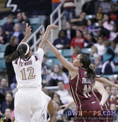 Courtney Ward shoots over Jaclyn Thoman -  - 