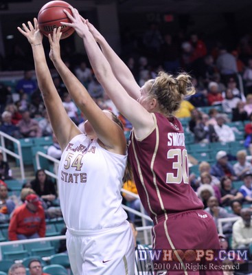 Carolyn Swords reaches over Cierra Bravard (54) for a rebound -  - 