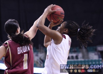 Ayla Brown fouls FSU's Angel Gray in the act -  - 