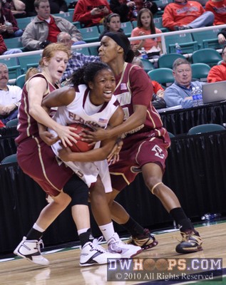 Mickel Picco (left) and Jasmine Gill tie up FSU's Angel Gray -  - 
