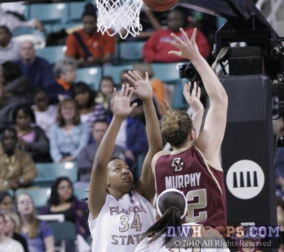 Stefanie Murphy fires a layup past Chelsea Davis -  - 